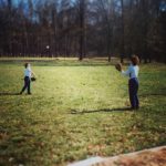 John Andrew Williams throwing a ball with her son